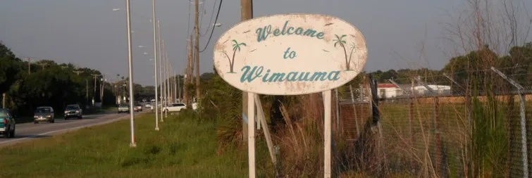 A sign saying "Welcome to Wimauma"